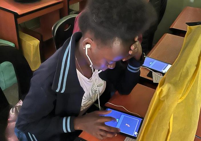 p. 21 - PHOTO-2023-12-01-22-59-13 7 Zambia girl (hero) taking test - crop